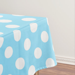White polka dots on pale blue tablecloth