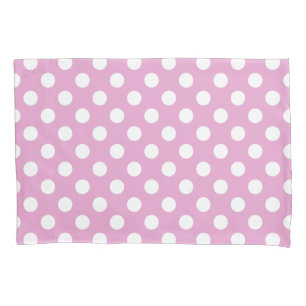 White polka dots on pale pink pillowcase