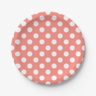 White polka dots on peach paper plate