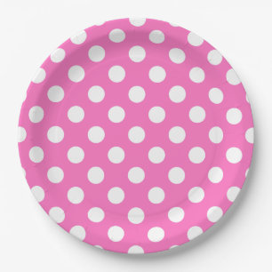 White polka dots on pink paper plate