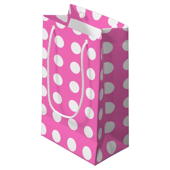 White polka dots on pink small gift bag (Front Angled)