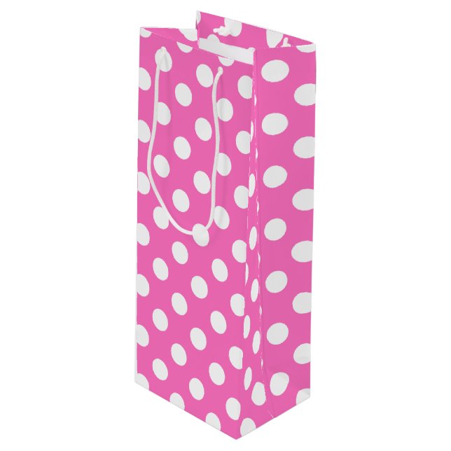 White polka dots on pink wine gift bag (Front Angled)