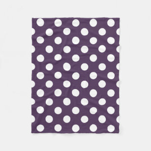 White polka dots on plum purple fleece blanket