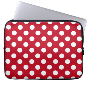 White polka dots on red laptop sleeve