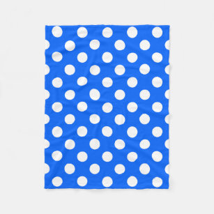 White polka dots on royal blue fleece blanket