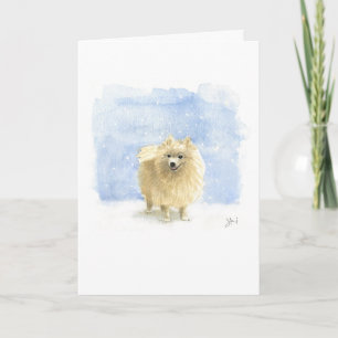 White Pomeranian Eskie Dog in the Winter Snow Holiday Card