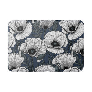 White poppies on navy bath mat