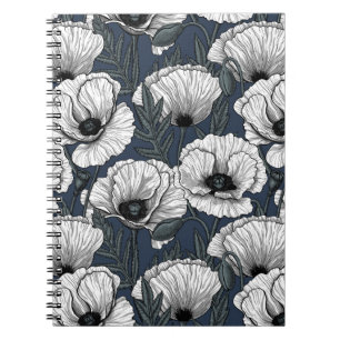 White poppies on navy notebook