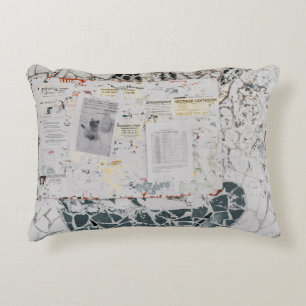 White printer paper on white and grey concrete wal accent pillow