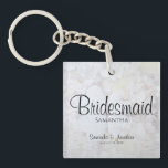 White Reflections Bridesmaid Wedding Favour Keychain<br><div class="desc">This beautiful keychain is perfect for thanking your bridesmaids. Designed as a part of our White Reflections Wedding Suite, it features black text over a background of reflecting white flowers and hearts. The text is fully customizable and reads: Bridesmaid, with a place for her name, the couple's names and wedding...</div>