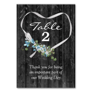 White Ribbon Heart On Barn Wood Table Number