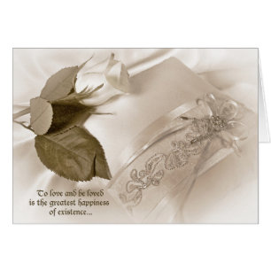 white rose on wedding pillow