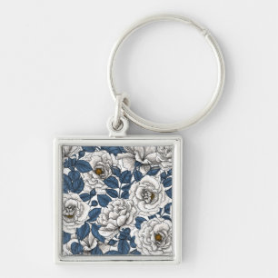 White roses with blue leaves on white keychain