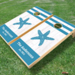 White rustic wood teal starfish family beach house cornhole set<br><div class="desc">Wherever you set up this cornhole set, you can be rest assured that the summer seashore fun will continue. A graphic, dusty teal blue vintage starfish overlays beachy white rustic, weathered, coastal wood. Great for family reunions, weddings, and backyard bbqs! Just type in your family name, year established, and you...</div>