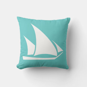 white sailboat on teal blue pillow
