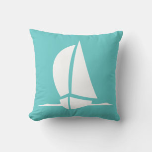 white sailboat on teal blue pillow