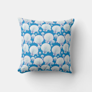 White sea shells on an ocean blue background throw pillow