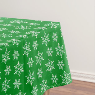 White Snowflake Pattern on Green Tablecloth