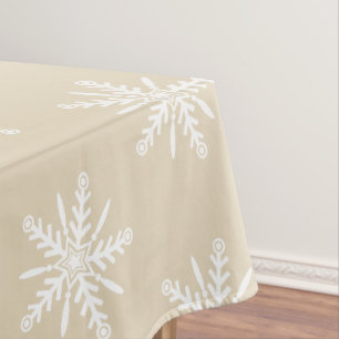 White snowflakes on beige Xmas tablecloth. Tablecloth