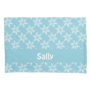 White snowflakes on blue pillowcase