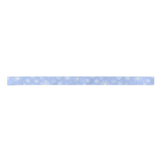 White snowflakes on blue satin ribbon