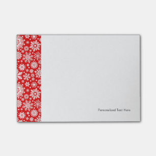 White snowflakes on red post-it notes