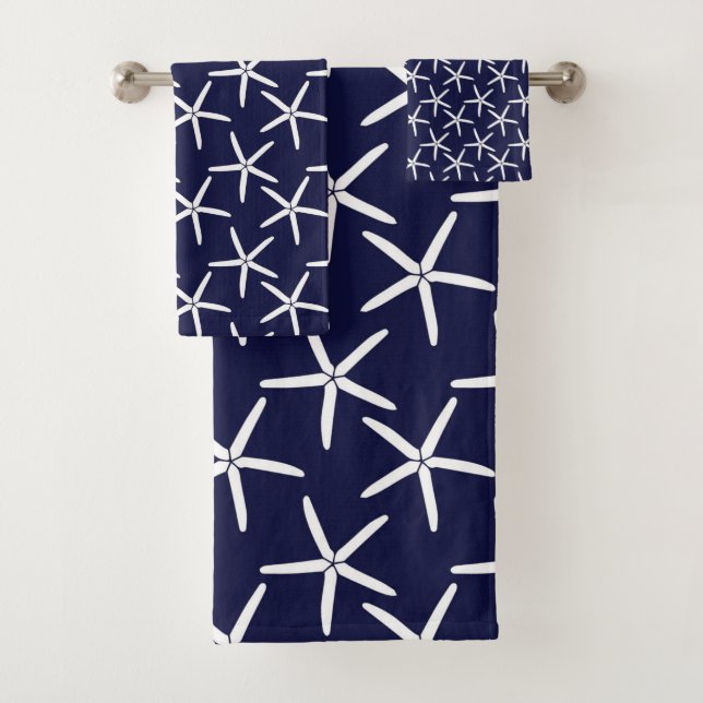 White starfish on a navy blue background bath towel set (Insitu)