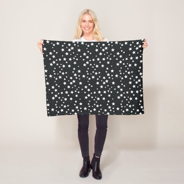 White Stars on Black Background Fleece Blanket (In Situ)
