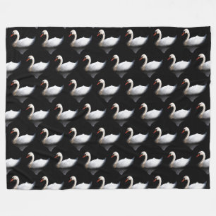 White swan on black fleece blanket