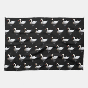 White swan on black kitchen towel