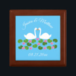 White Swans and Water lilies Wedding Custom Gift Box<br><div class="desc">This awesome Wedding gift box features a digital art image of a pair of beautiful white swans with orange becks facing each other looking like they are kissing. Underneath the swans is a group of pretty pink water lily flowers with yellow centres and green lily pads. A beautiful wedding design....</div>