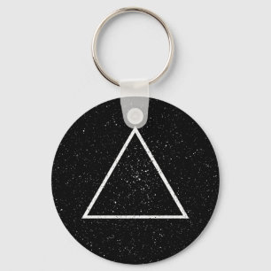 White triangle outline on black star background keychain