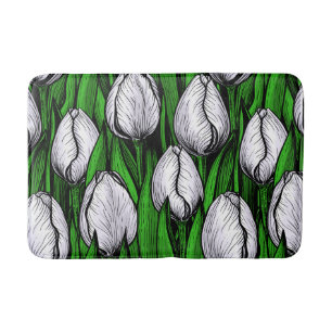 White tulips with green leaves bath mat