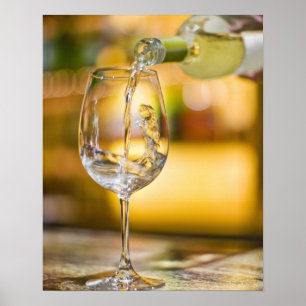 White wine is poured from bottle in restaurant. poster