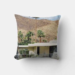WHITE WOODEN FENCE NEAR GREEN PALM TREE DURING DAY THROW PILLOW