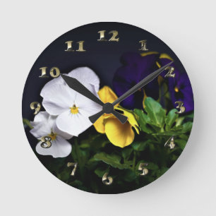 White Yellow and Purple Pansies Round Clock