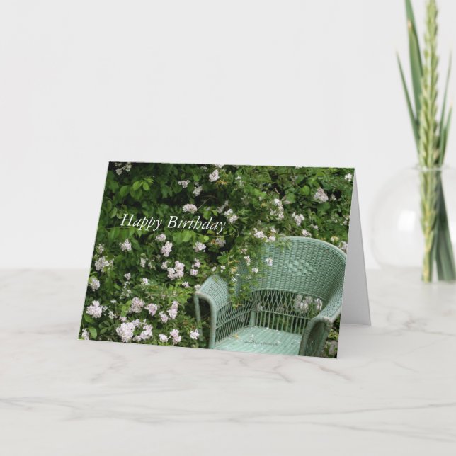 Wicker chair among blossoms Birthday Greeting Card (Front)