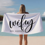 Wifey Black And White Newlywed Bride Beach Towel<br><div class="desc">Celebrate your new status with this stylish "Wifey" beach towel in classic black and white, perfect for honeymoons, beach outings, or poolside relaxation. Designed with newlyweds in mind, this towel can be personalized with a last name, making it an ideal gift or accessory for brides. Whether for a beach honeymoon...</div>