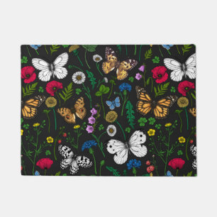 Wild flowers and butterflies on black doormat