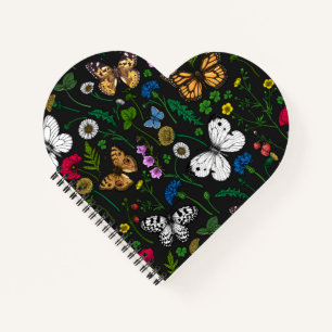 Wild flowers and butterflies on black notebook