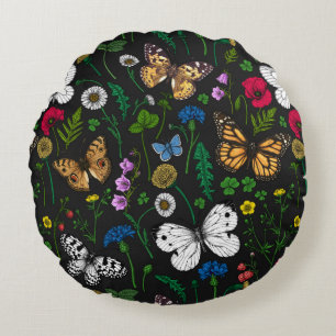 Wild flowers and butterflies on black round pillow