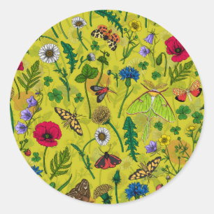 Wild flowers and moths on green classic round sticker