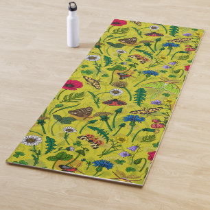 Wild flowers and moths on green yoga mat