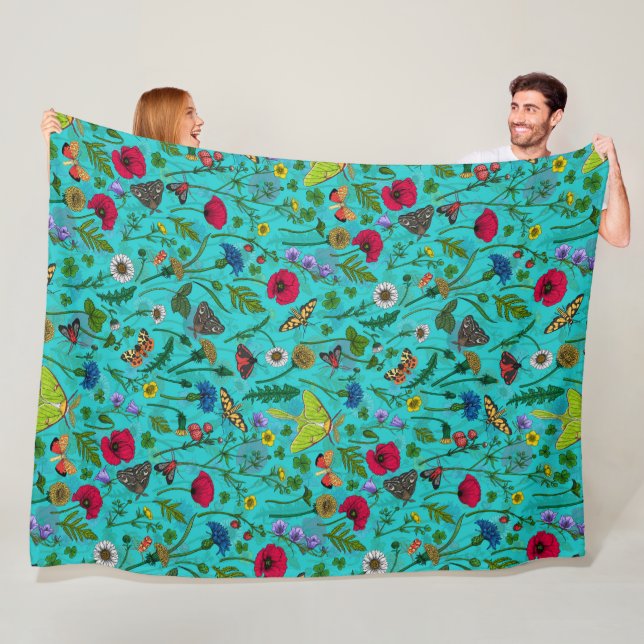 Wild flowers and moths on teal fleece blanket (In Situ)