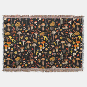 Wild mushrooms on black throw blanket