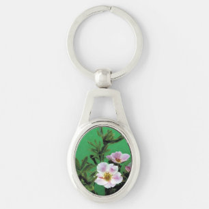 wild pink rose flowers in green. keychain