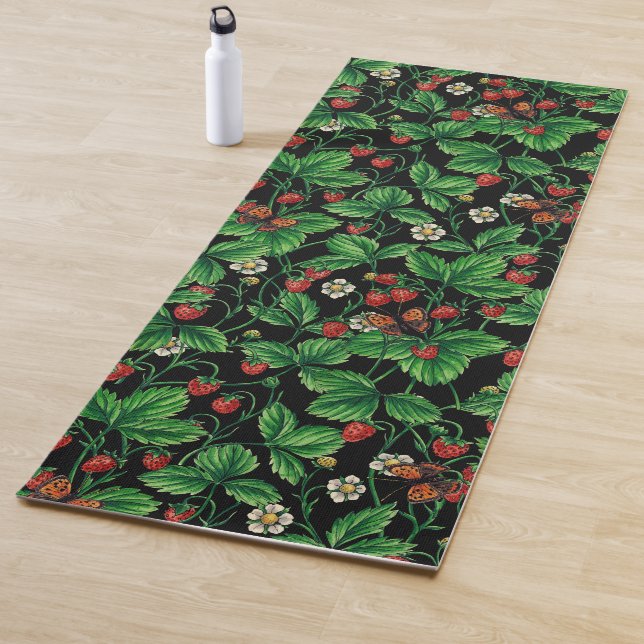 Wild strawberries on black yoga mat (In Situ)