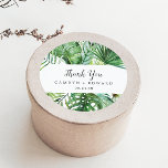 Wild Tropical Palm Thank You Wedding Favour Sticke Classic Round Sticker<br><div class="desc">These wild tropical palm thank you wedding favour stickers are perfect for a beach or destination wedding reception. The design features an exotic array of green watercolor banana palm tree leaves, ferns, foliage, botanical plants and greenery for a tropical summer feel. Personalize the sticker labels with your names, the event...</div>