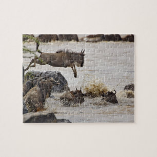 Wildebeest jumping into Mara River Jigsaw Puzzle
