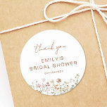 Wildflower Thank You Bridal Shower In Bloom Classic Round Sticker<br><div class="desc">Express gratitude with our Wildflower Thank You Bridal Shower In Bloom Classic Round Sticker. These charming stickers feature a delightful wildflower design, infusing a touch of natural beauty into your bridal shower thank-you notes or favours. The classic round shape adds versatility, making them perfect for various uses, from sealing envelopes...</div>
